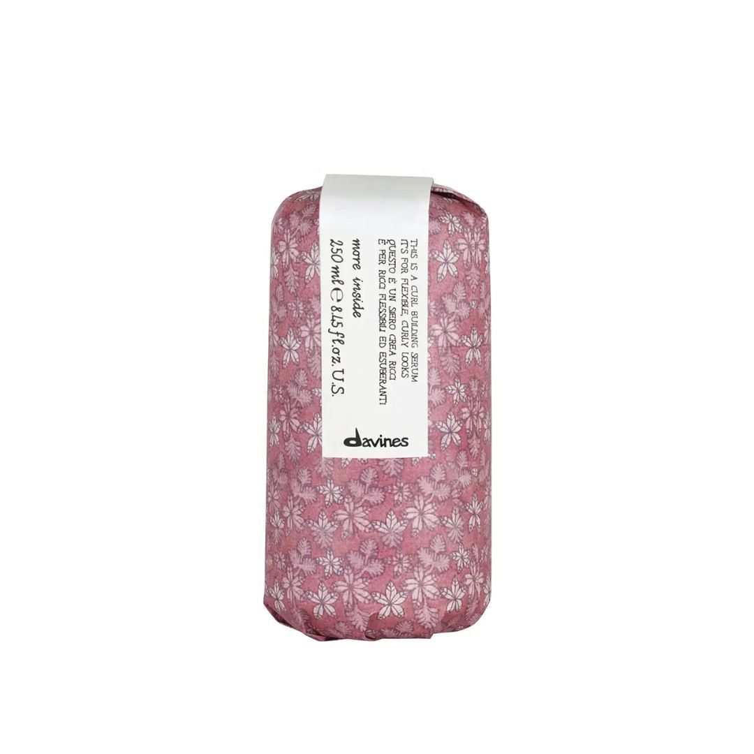 Bar of soap with floral packaging and a label on a white background
