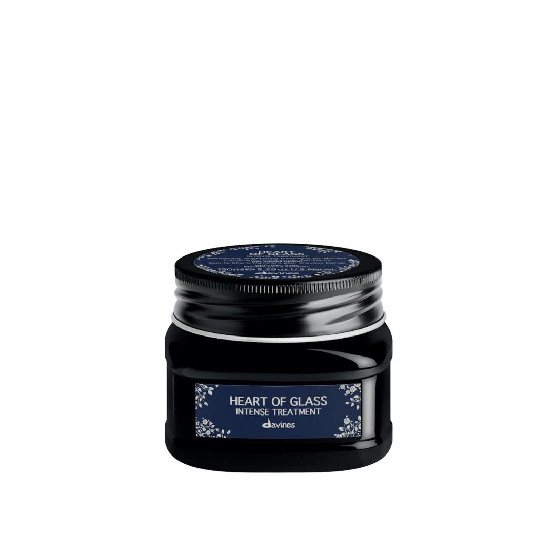 Black hair treatment jar labeled 'Heart of Glass' on a white background